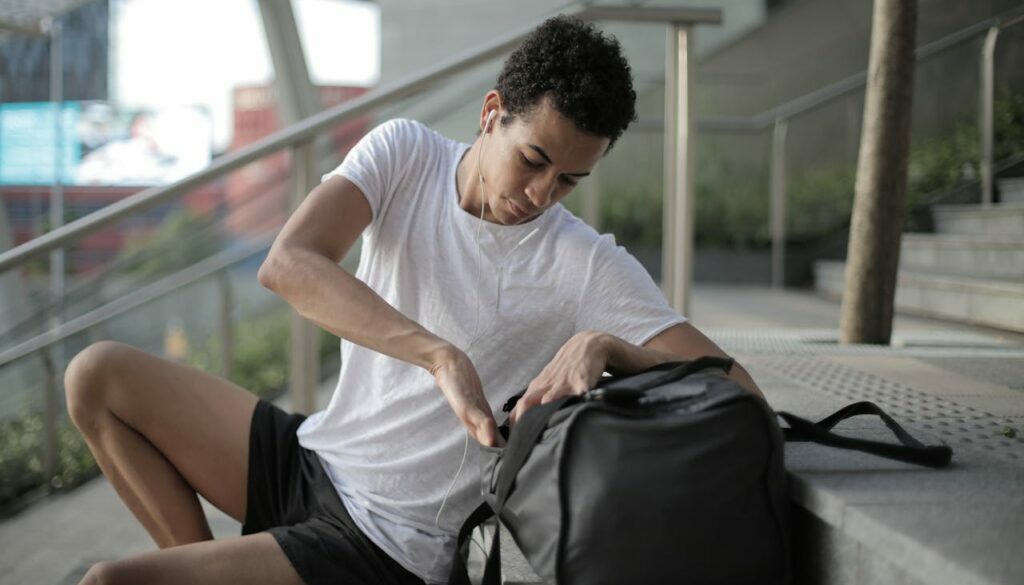 Student on step checking gym bag